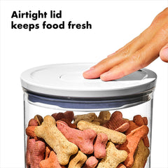 Button operation on OXO Pet POP for quick open and secure seal.