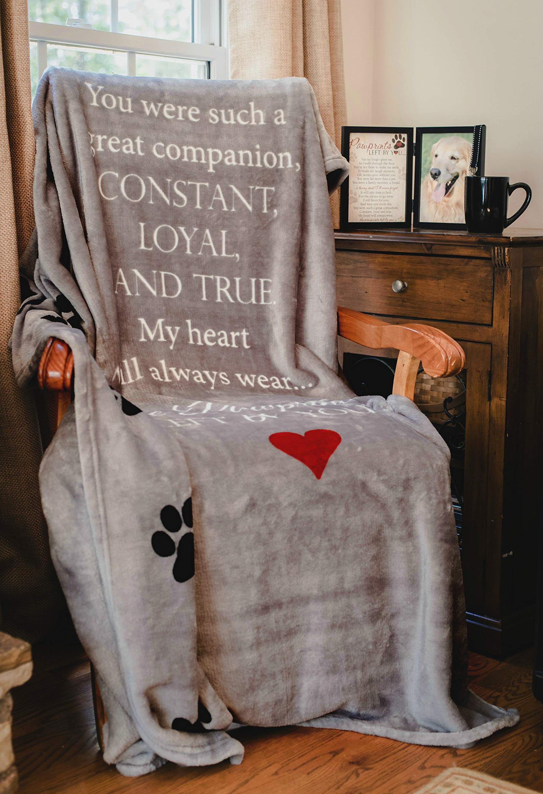 Pawprints Left by You memorial blanket in a cozy home setting.