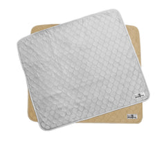 Pet Parents Pawtect Pads two-pack gray-tan on the floor offers reusable mess protection.