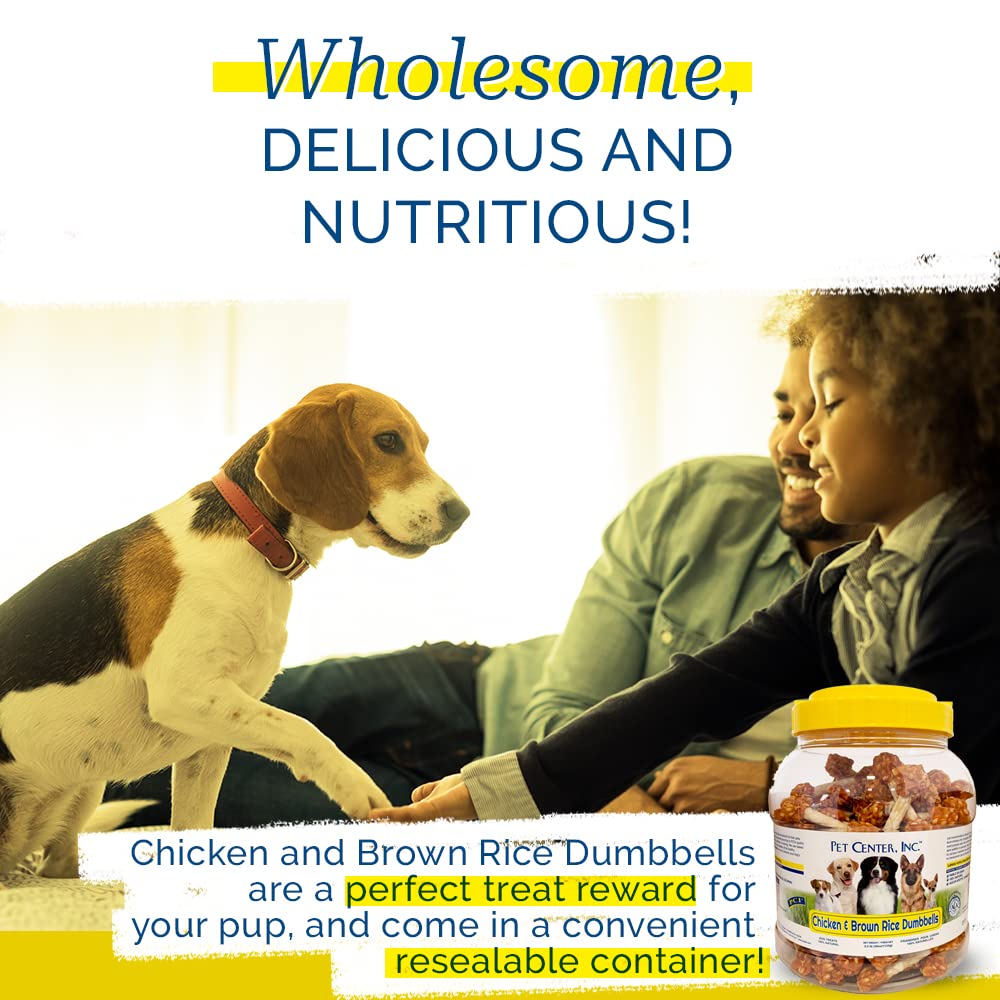 Dog enjoys PCI Pet Center dumbbell treat during training