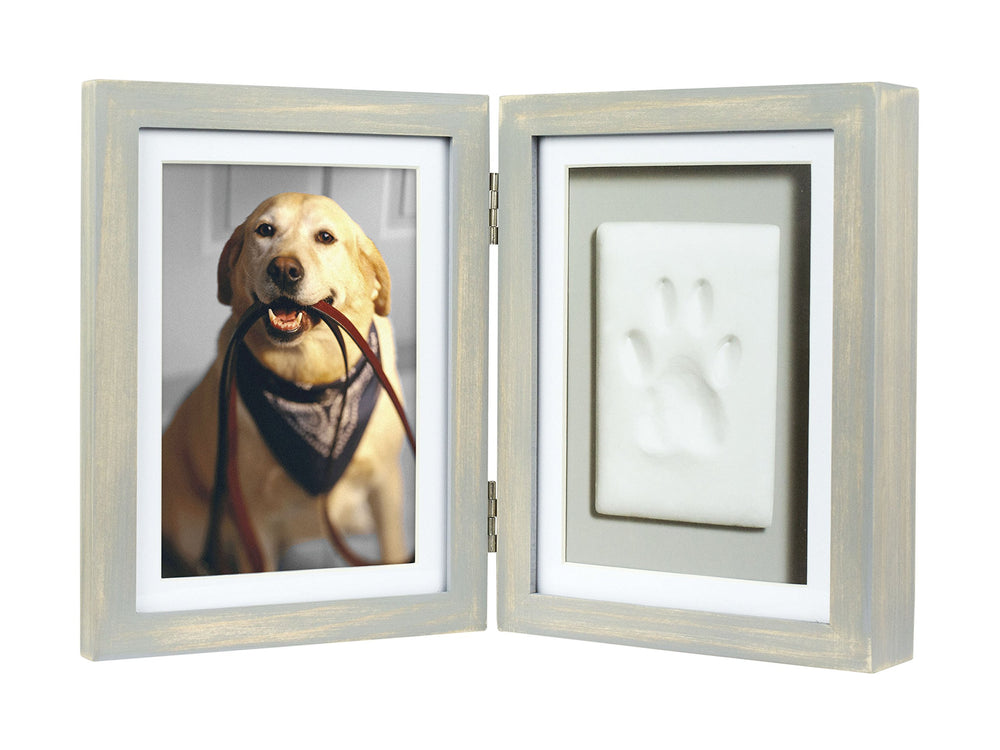 Pearhead paw print frame with wooden hinge displays your pet’s print beside a cherished photo at home