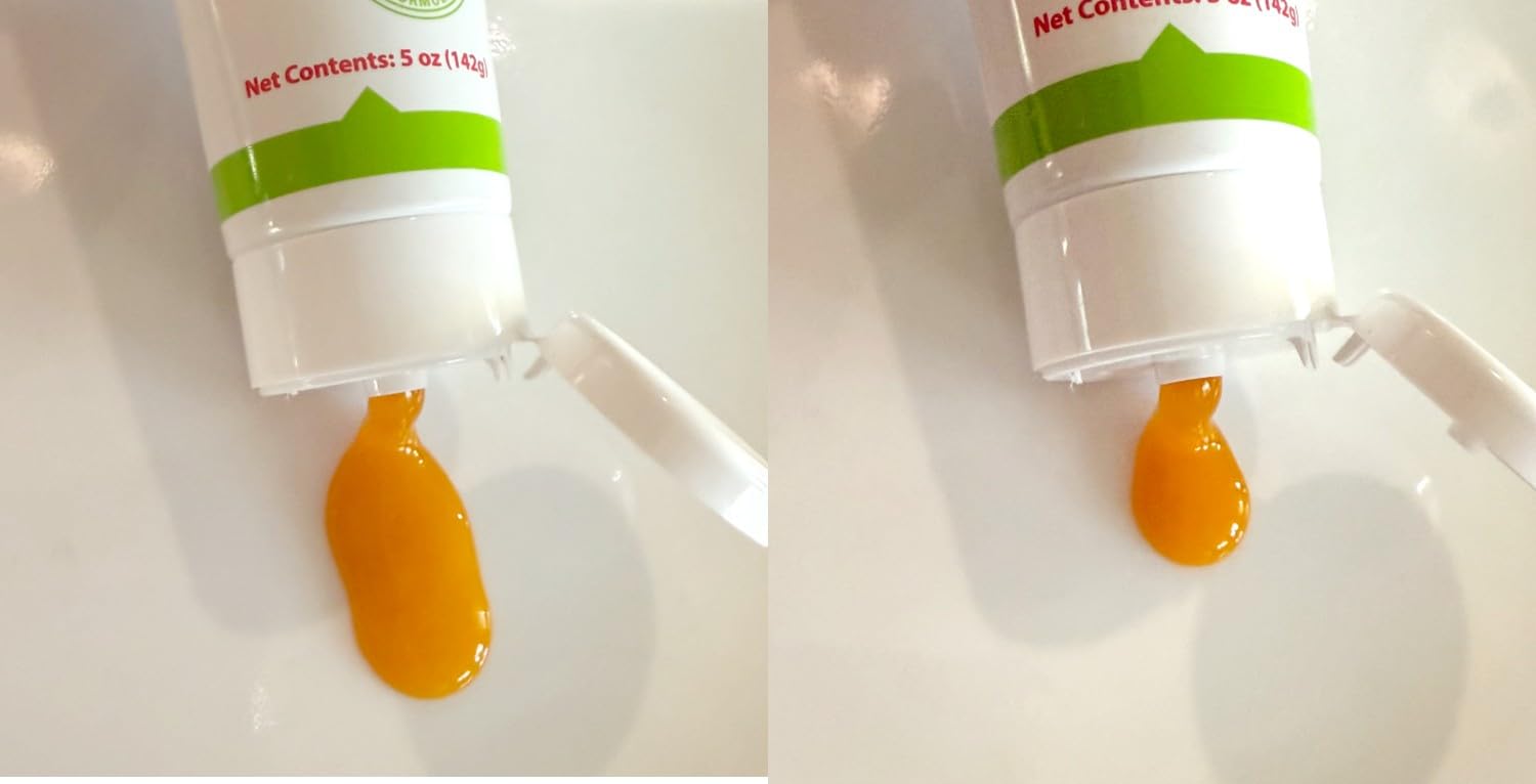 Cat being dosed with Trulysine Viralysine gel showing simple administration