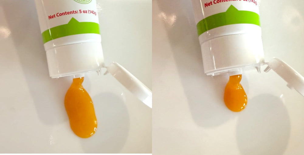Cat being dosed with Trulysine Viralysine gel showing simple administration