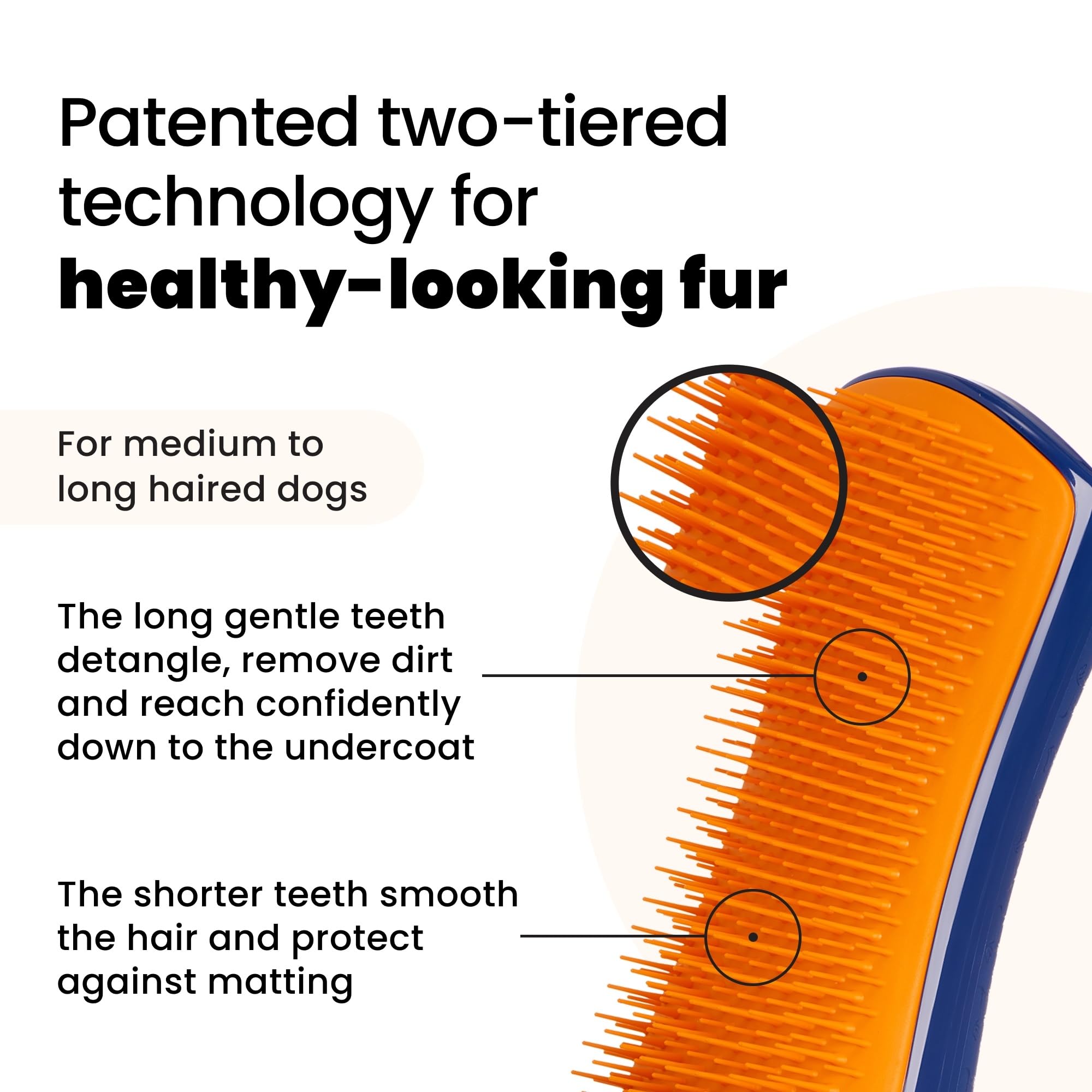Pet Teezer grooming brush held in hand with ergonomic palm friendly design