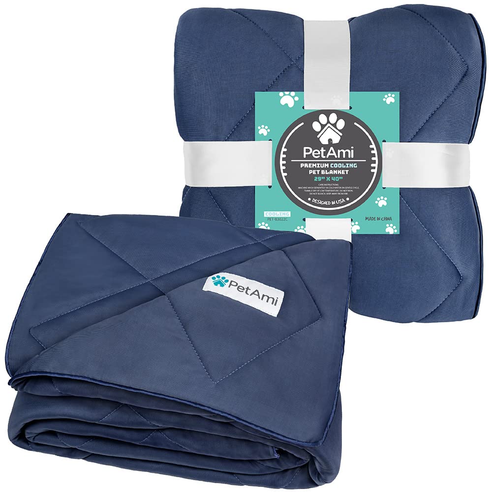 Navy PetAmi blanket protecting a sofa from fur and scratches.