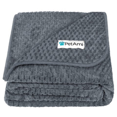 PetAmi waterproof dog blanket on a couch protects furniture from spills.