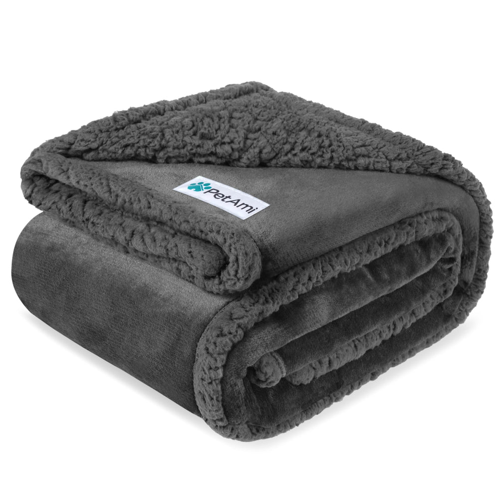 PetAmi waterproof dog blanket on a couch protects furniture from spills.