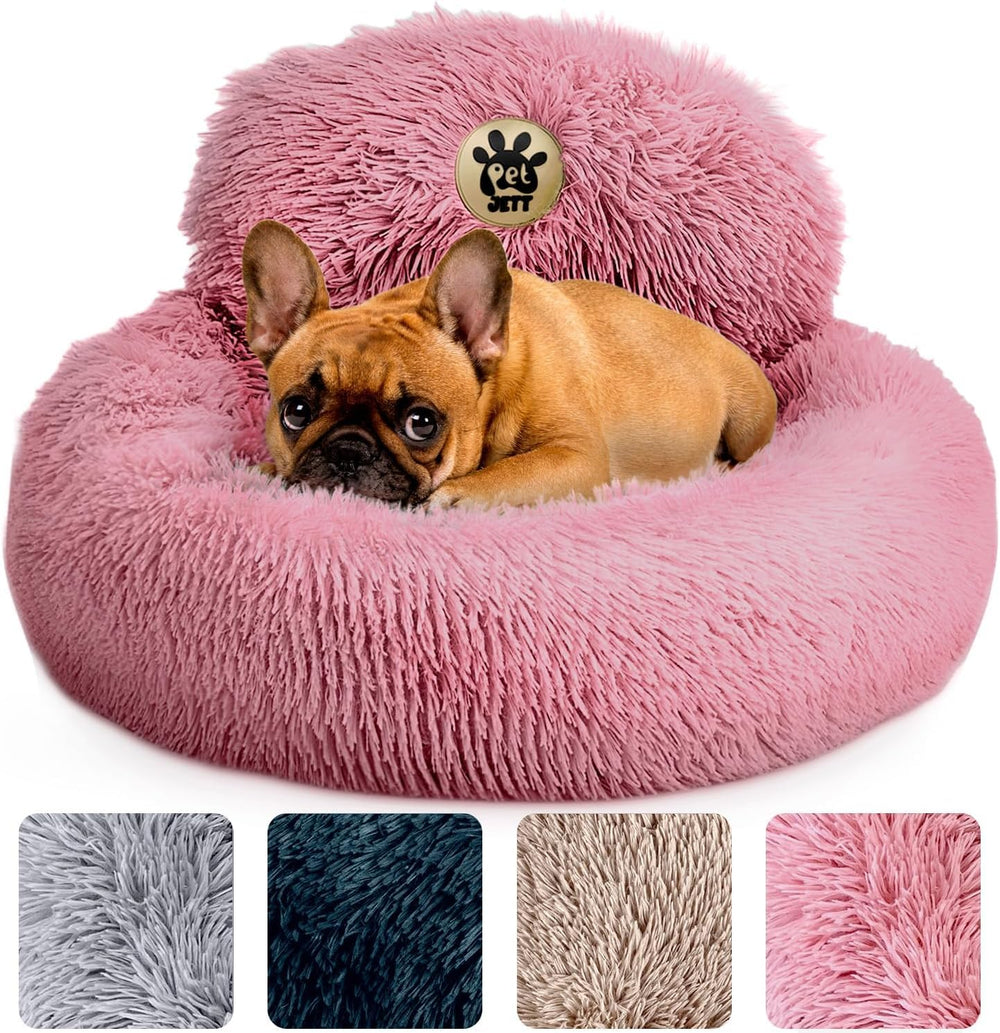 PetJett Calming Donut Bed 23-inch pink with plush fur for cozy naps.