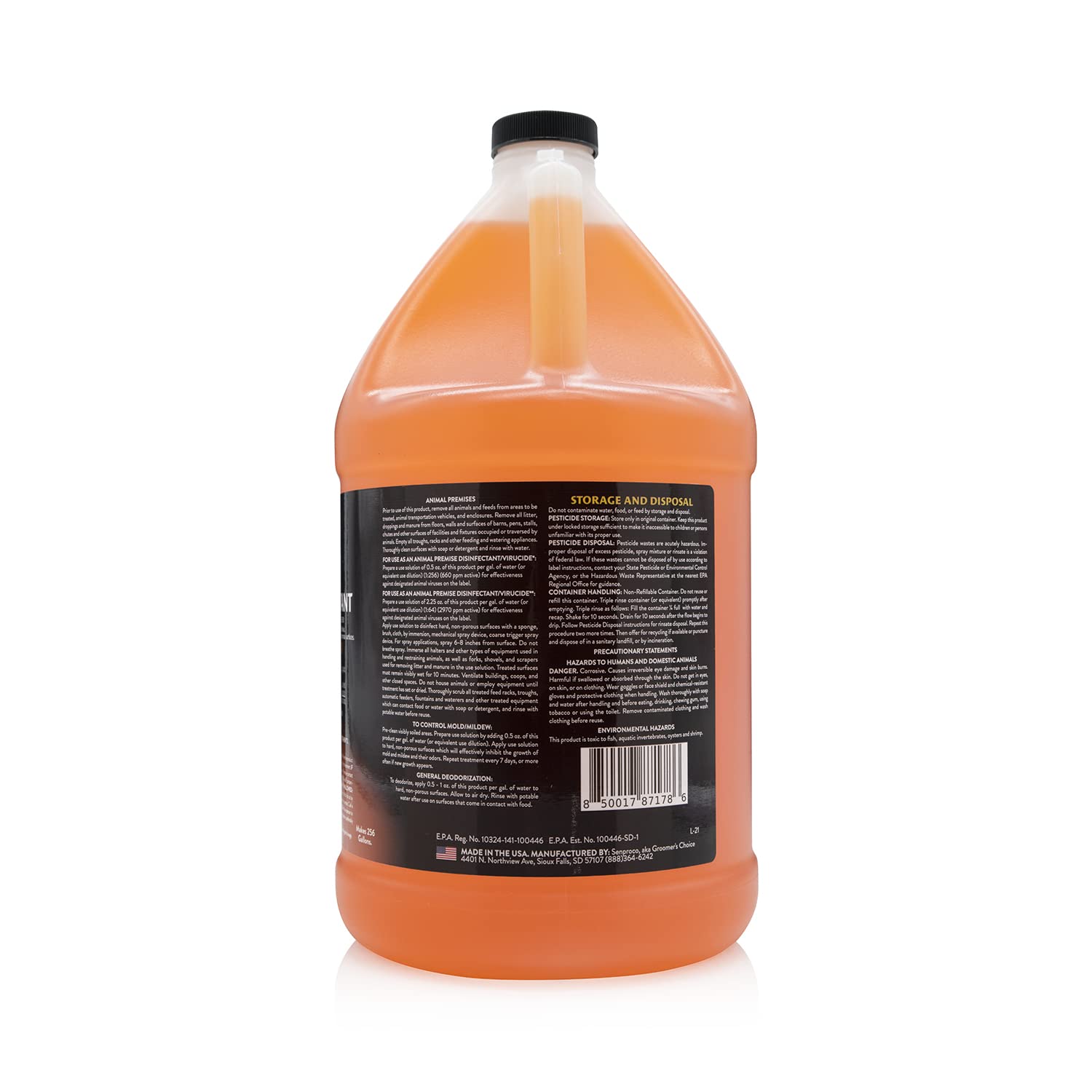 Petology spray bottle applying cleaner to kennel crate for quick sanitation