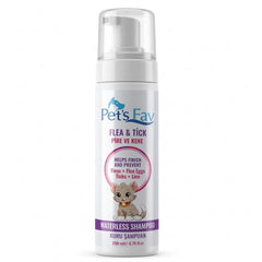 Pet's Fav waterless cat shampoo bottle in use for on-the-go foam cleaning.