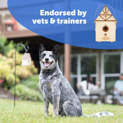 PetSafe Outdoor Bark Control mounted in a tree provides discreet bark deterrence.