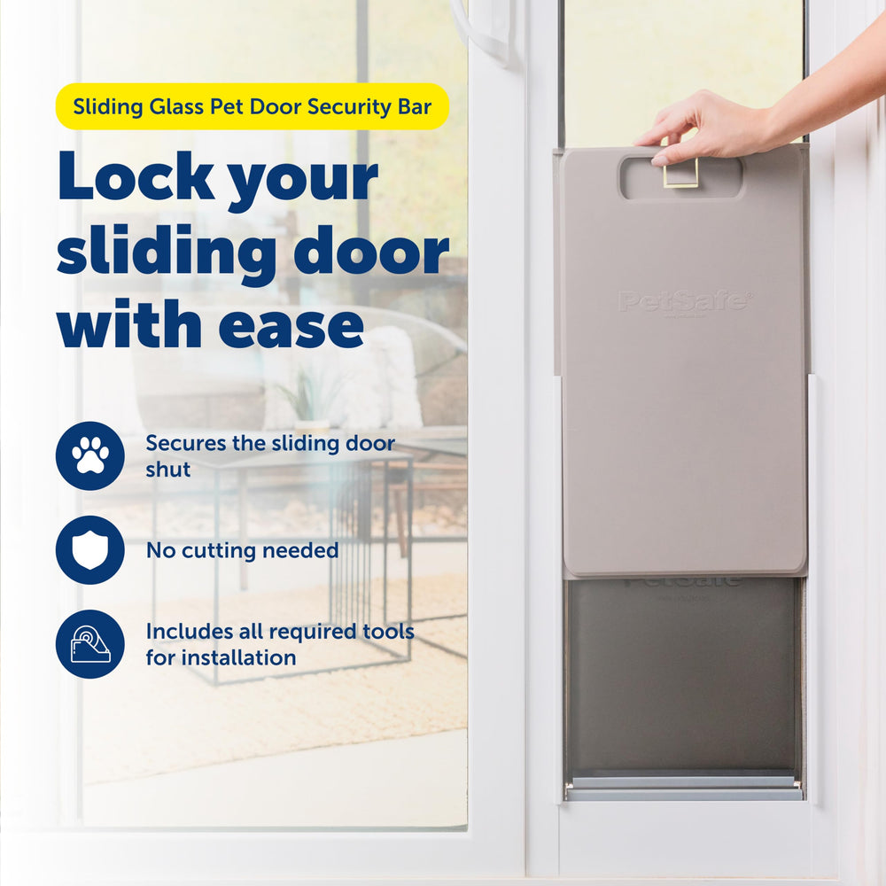 PetSafe security bar extended to 28 inches demonstrates adjustable fit for wide doors.