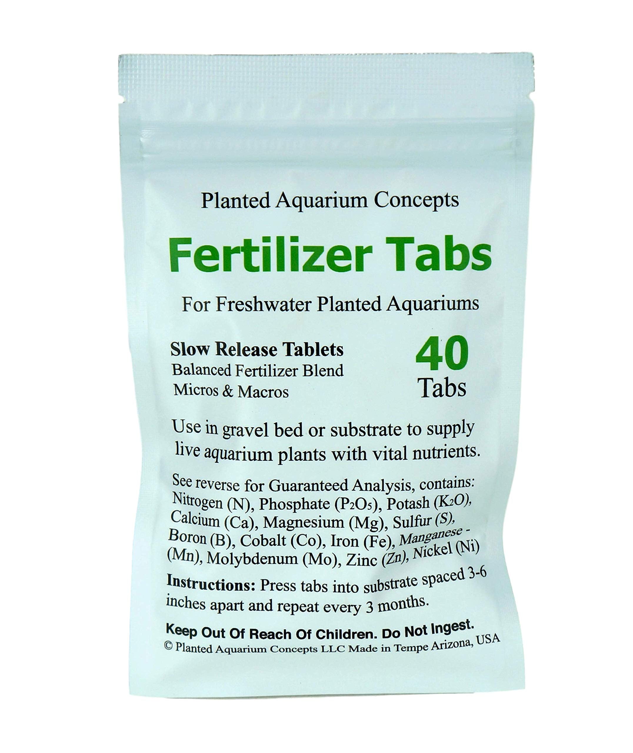 Close-up of tabs pressed into gravel bed delivering nutrients to aquatic plants