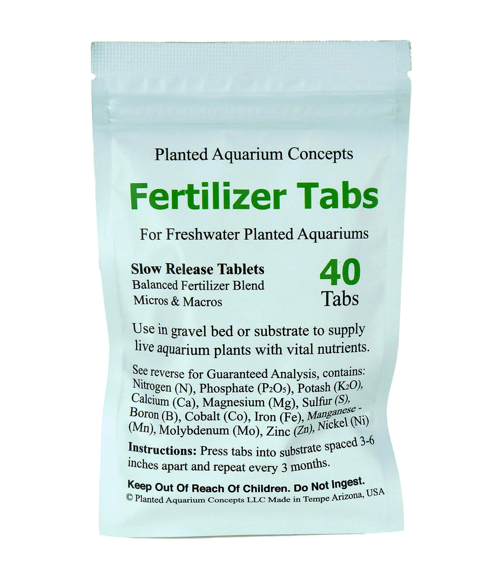 Close-up of tabs pressed into gravel bed delivering nutrients to aquatic plants