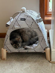 Pozico 2-in-1 cat teepee hammock offers secure elevated rest.
