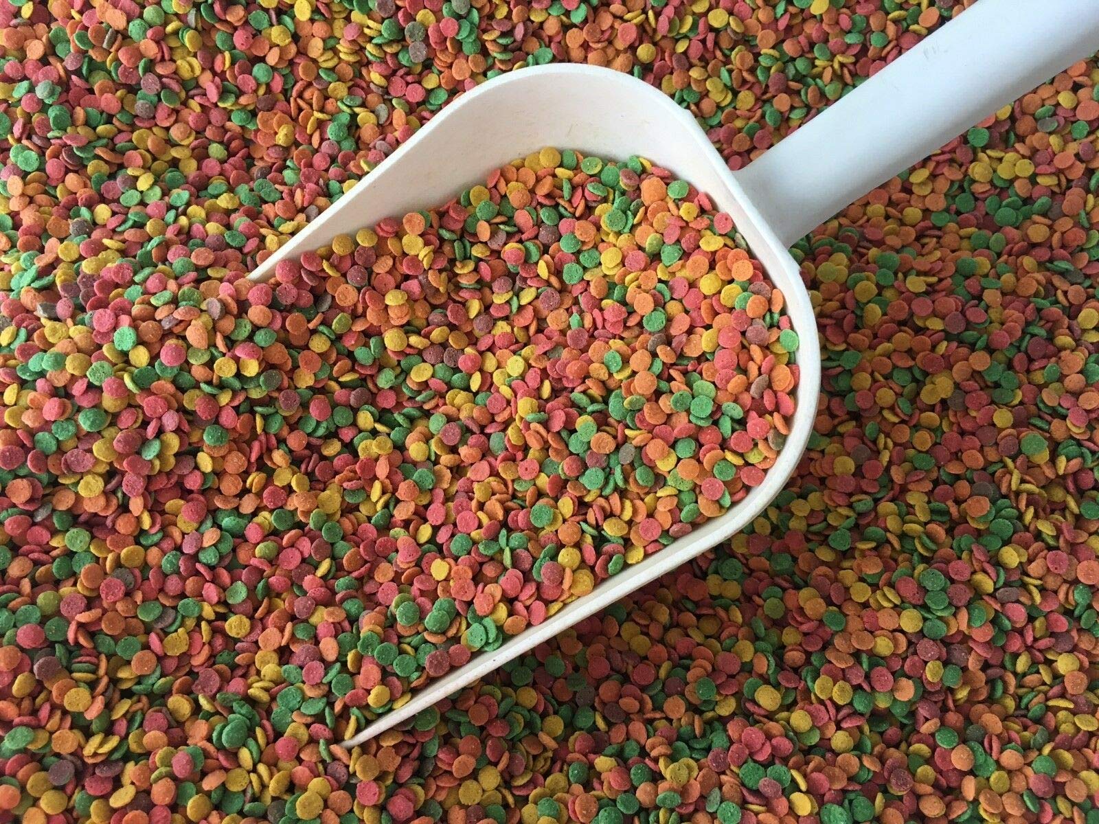 Pretty Bird Daily Select small bird food closeup shows multicolored extruded pieces for enrichment.