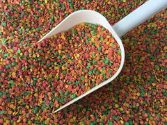 Pretty Bird Daily Select small bird food closeup shows multicolored extruded pieces for enrichment.