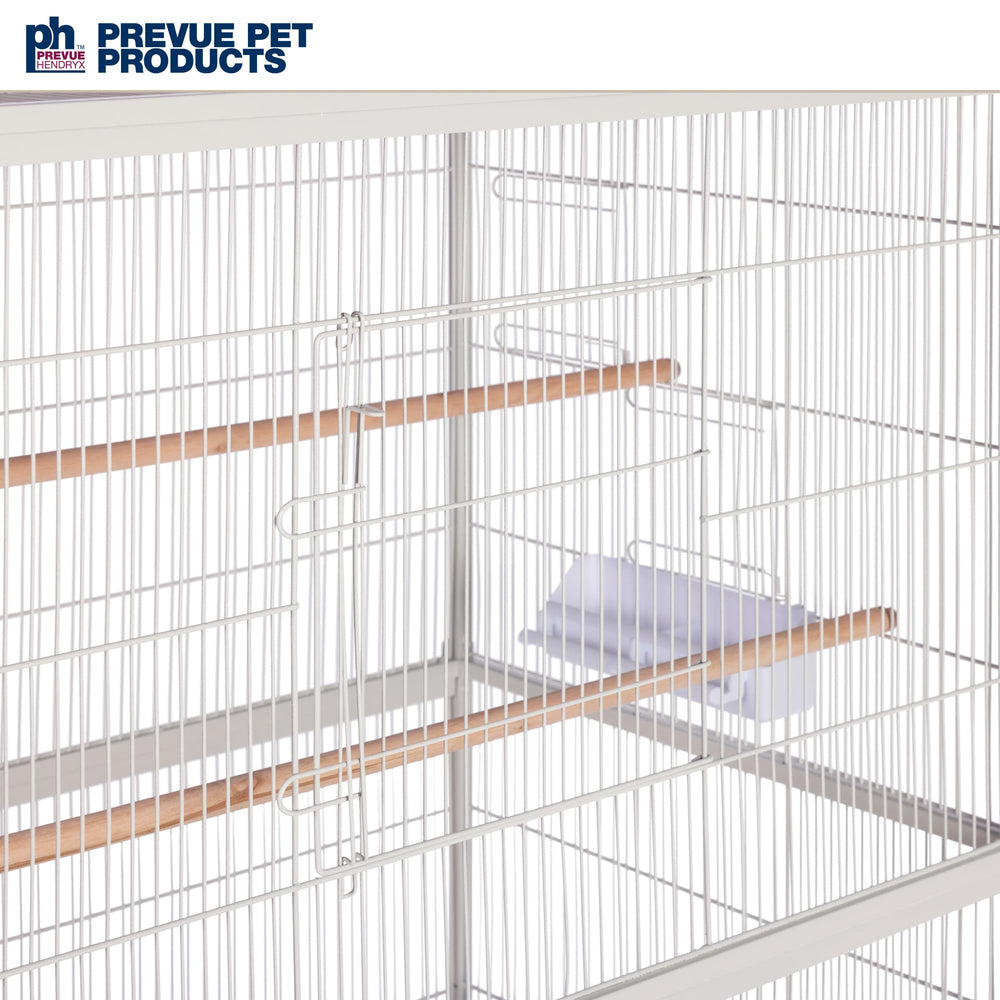 Three wood dowel perches at varied heights