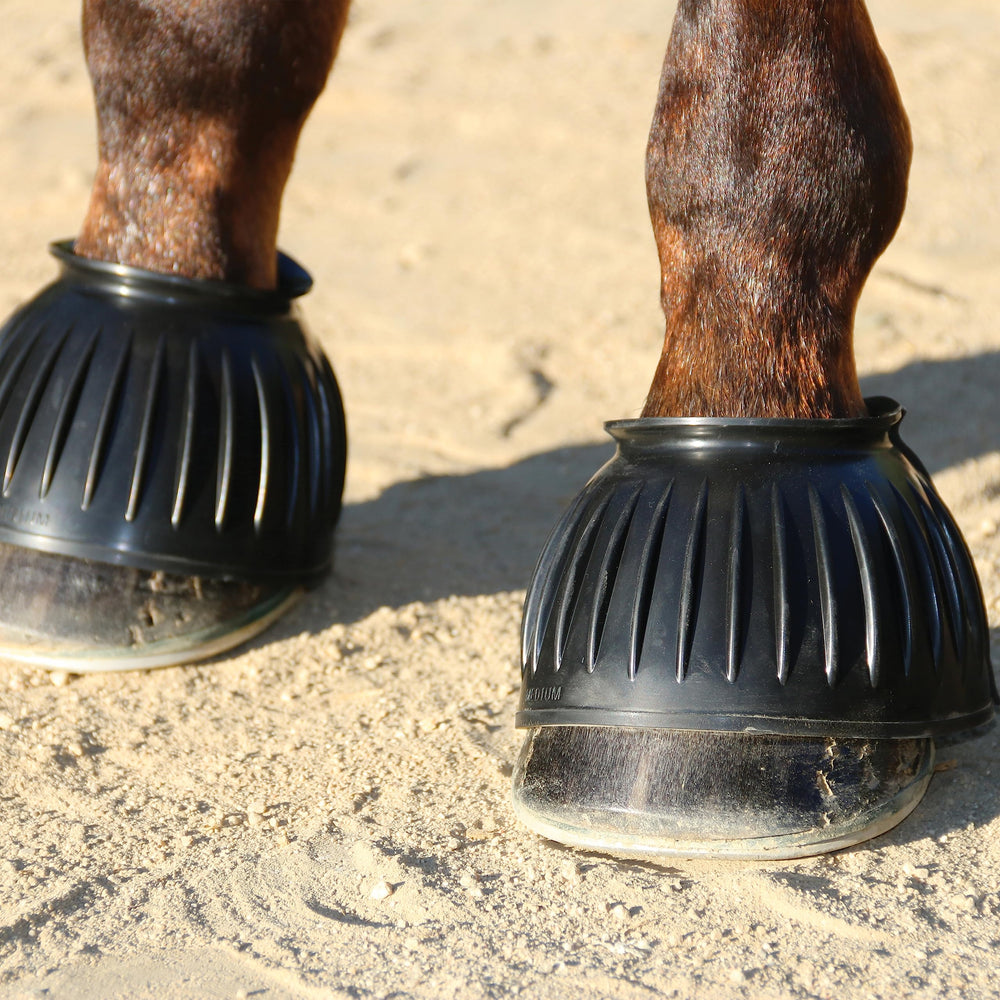 Professional's Choice pull-on rubber bell boots, black, on-hoof protection against overreaching during work.