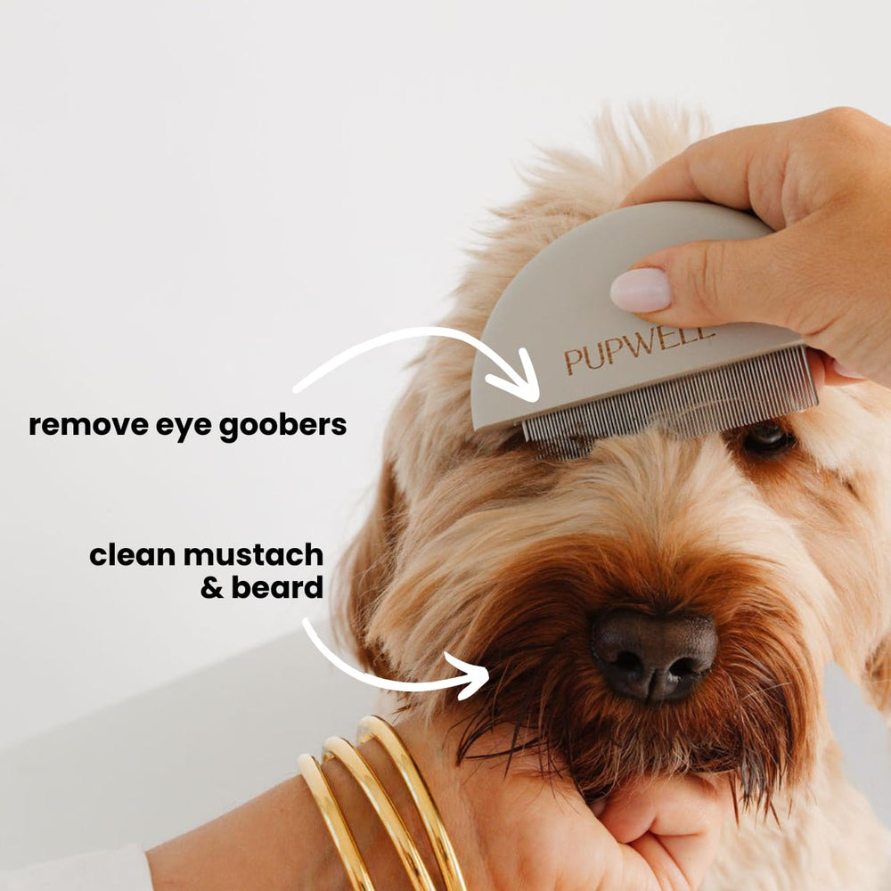 Close-up of Pupwell Detailer Comb removing eye goobers gently.
