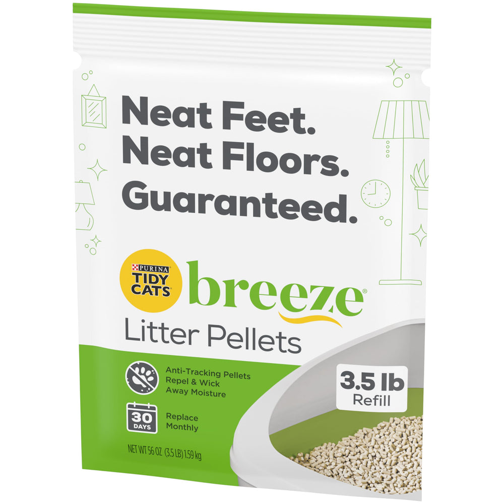 Purina Breeze pellets in scoop—easy pouring into litter box.