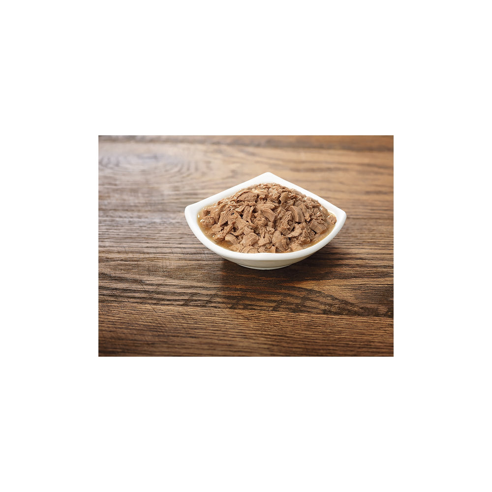Purina Pro Plan Gravy Salmon Entree in Sauce served in bowl highlighting moist texture for meals.