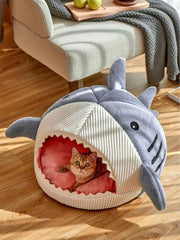 QWINEE cat mat shark-shaped bed blue interior, soft space for retreat and play.