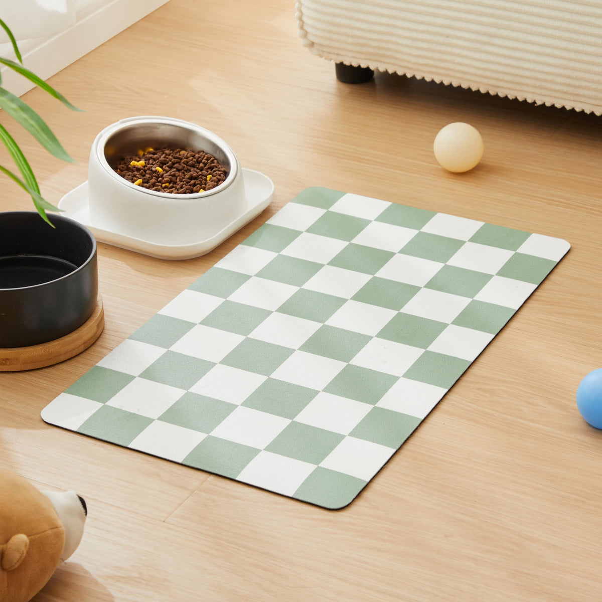 Ralxion checkered dog feeding mat in sage green adds style while protecting floors.