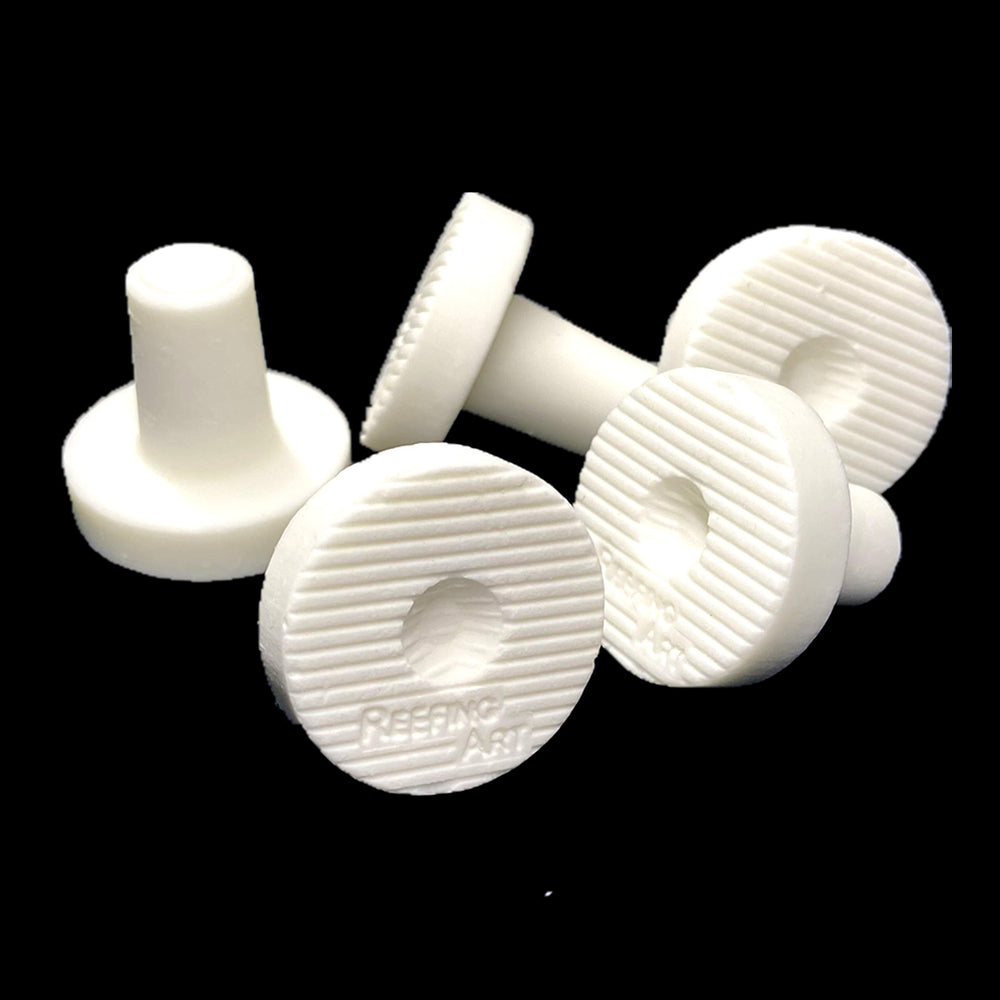 Reefing Art frag plug's rough surface aids coral attachment with center hole.