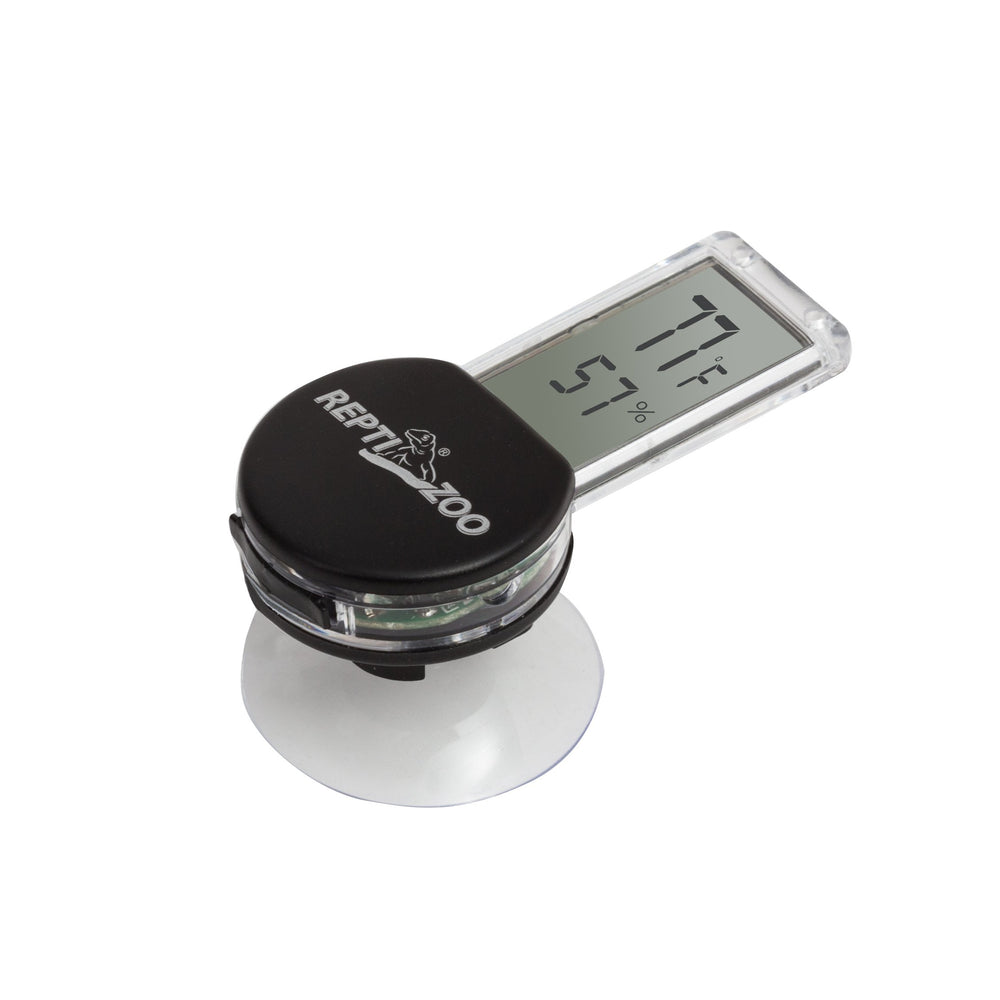 REPTI ZOO digital thermometer hygrometer on terrarium front for easy monitoring.