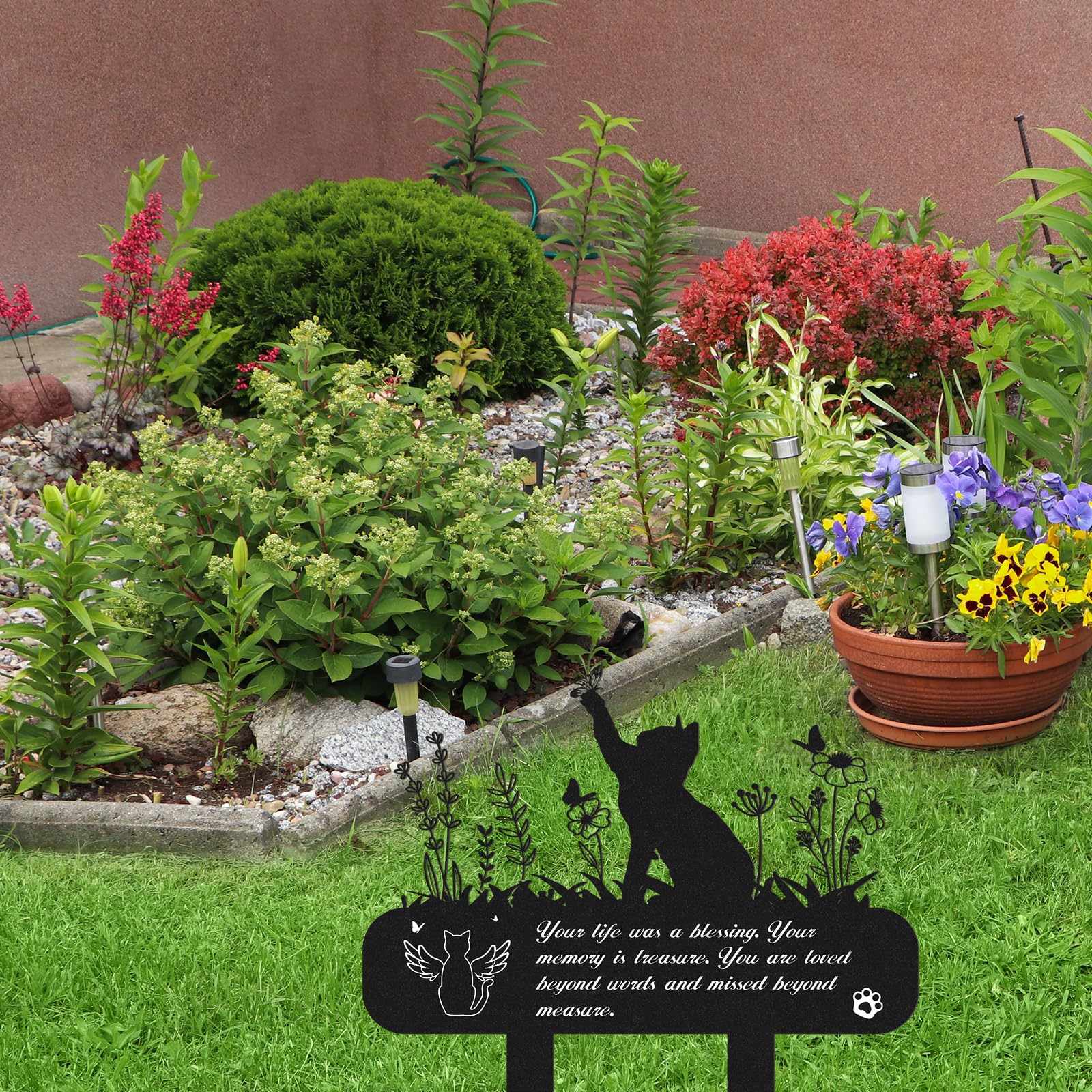 Rngmsi garden memorial marker for cats, a respectful yard tribute.