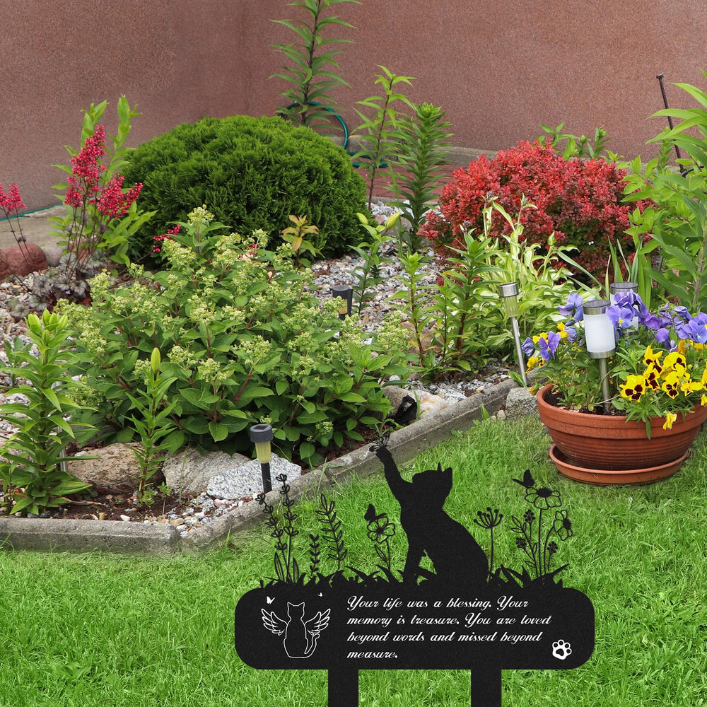 Rngmsi garden memorial marker for cats, a respectful yard tribute.