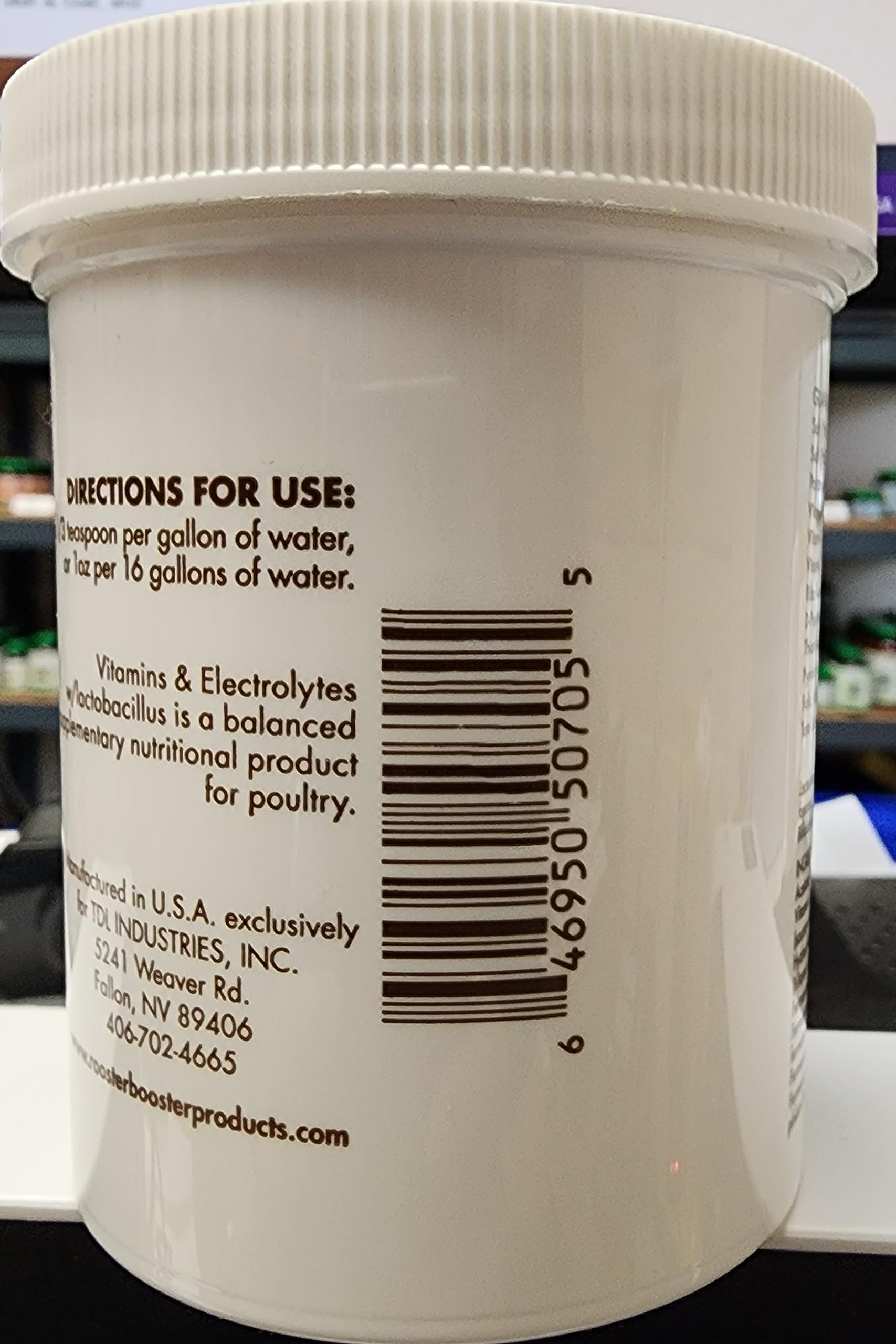 Rooster Booster vitamins and electrolytes label highlights live lactobacillus content for daily poultry supplementation.