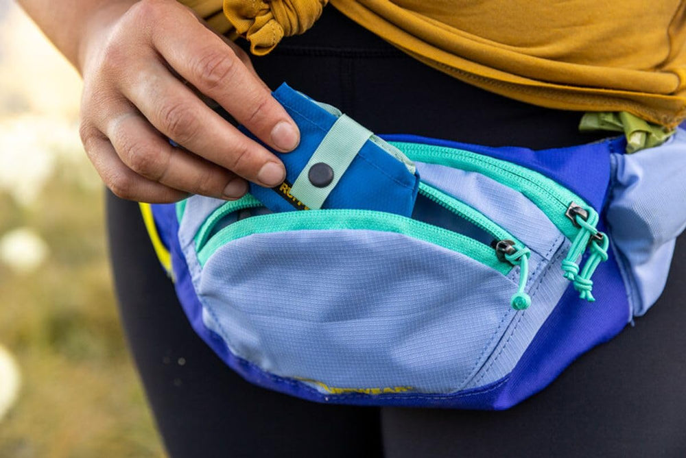 Ruffwear Trail Runner Bowl in blue pool color on the trail for visibility.