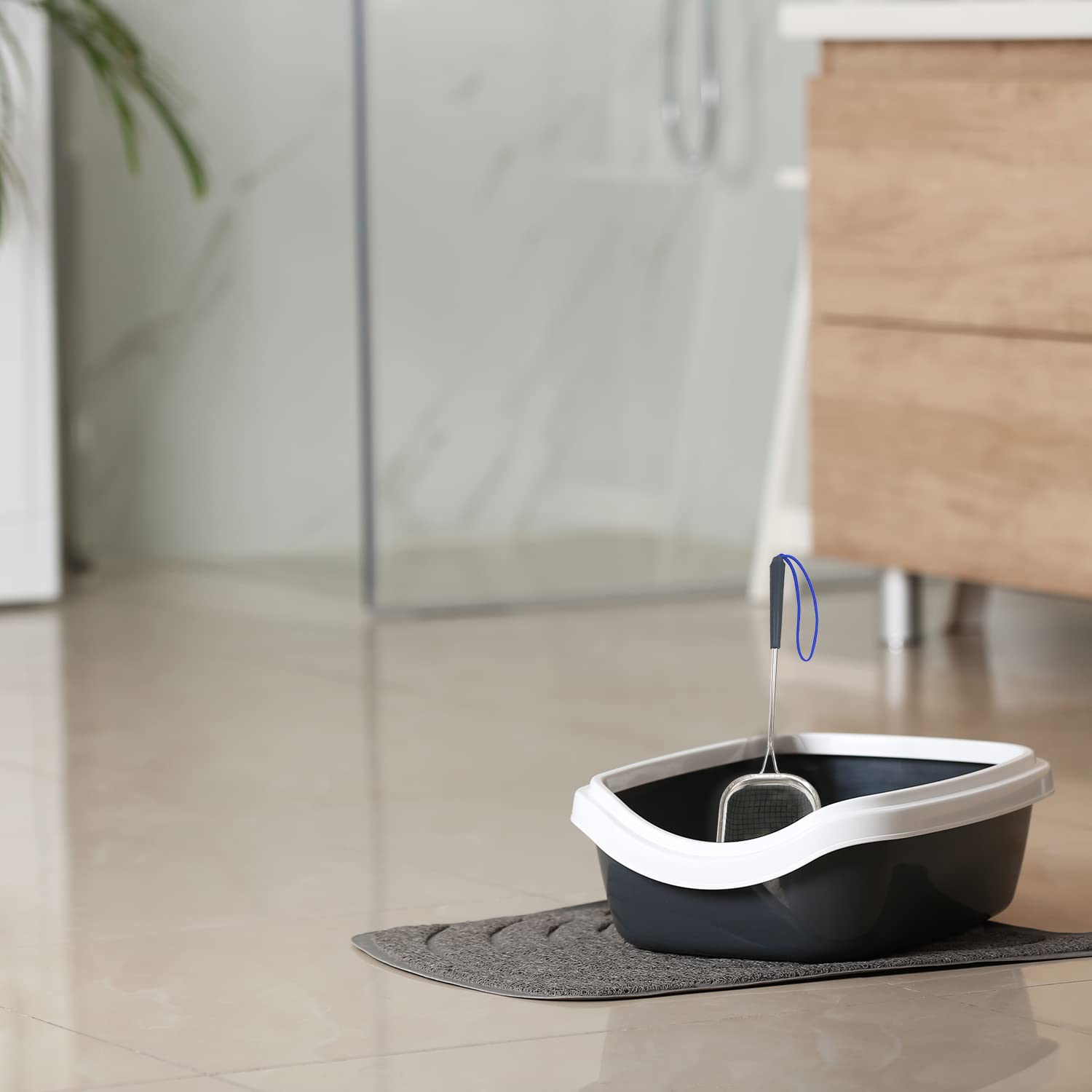 Sand Dipper metal scoop for quick litter box cleanup.