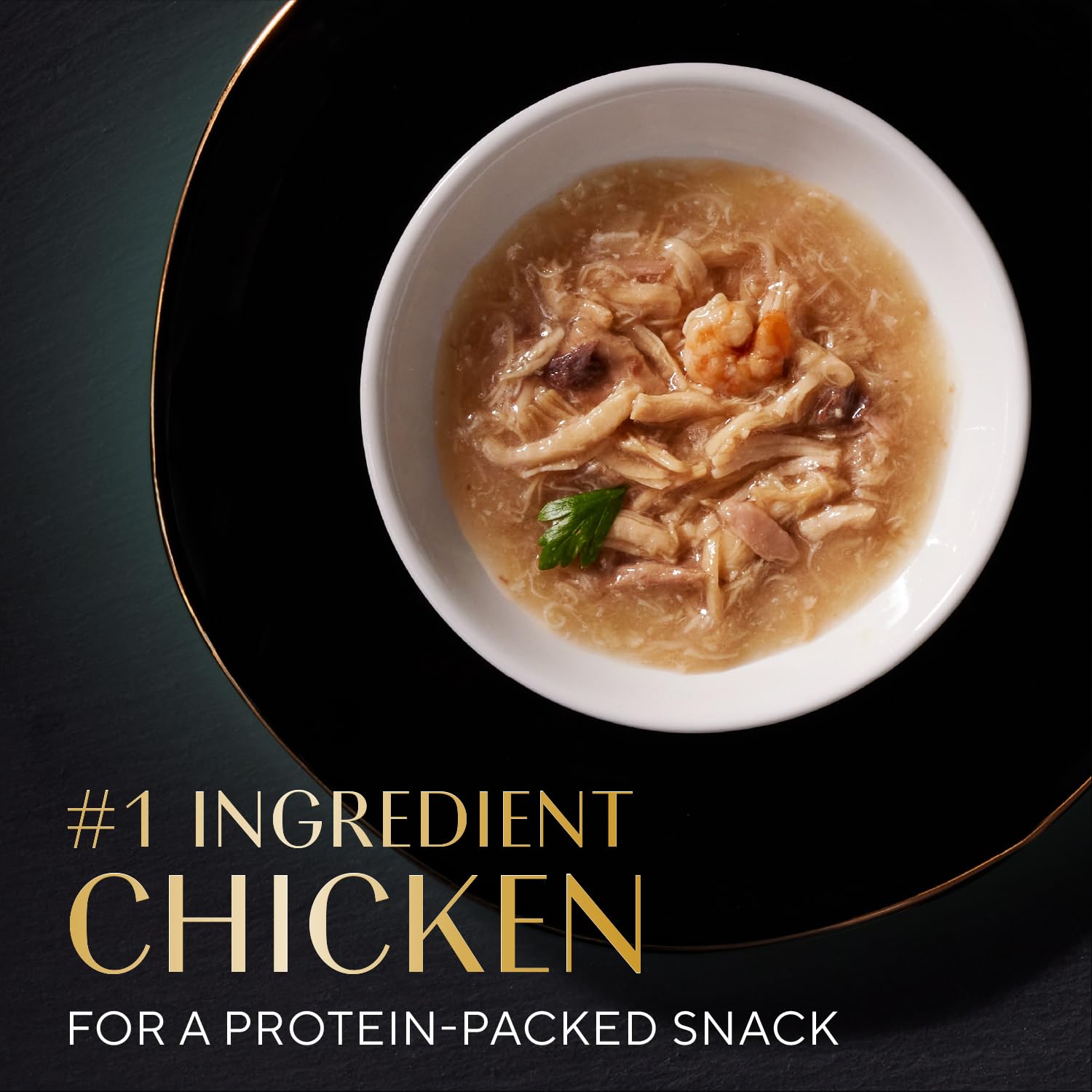 Close-up of Sheba Selections Filets in Broth cups highlights tender chunks in broth.