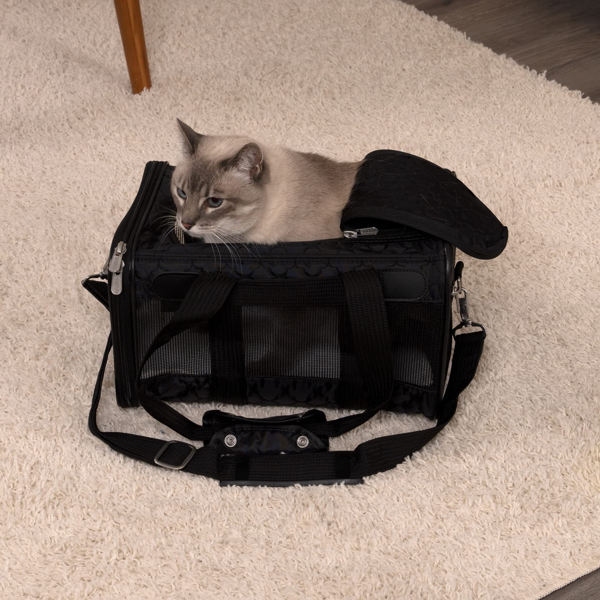 Sherpa Original Deluxe carrier under-seat fit for easy cabin compatibility.
