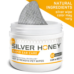 Silver Honey wipe being applied to a pet's outer ear to remove dirt.