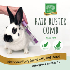 Small Pet Select Hair Buster Comb in hand showing ergonomic wooden handle for comfortable gripping