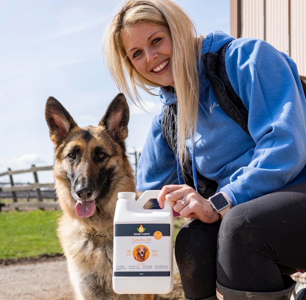 Smart Earth Camelina Oil for Dogs pouring onto meals during feeding.