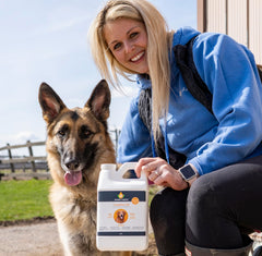Smart Earth Camelina Oil for Dogs pouring onto meals during feeding.