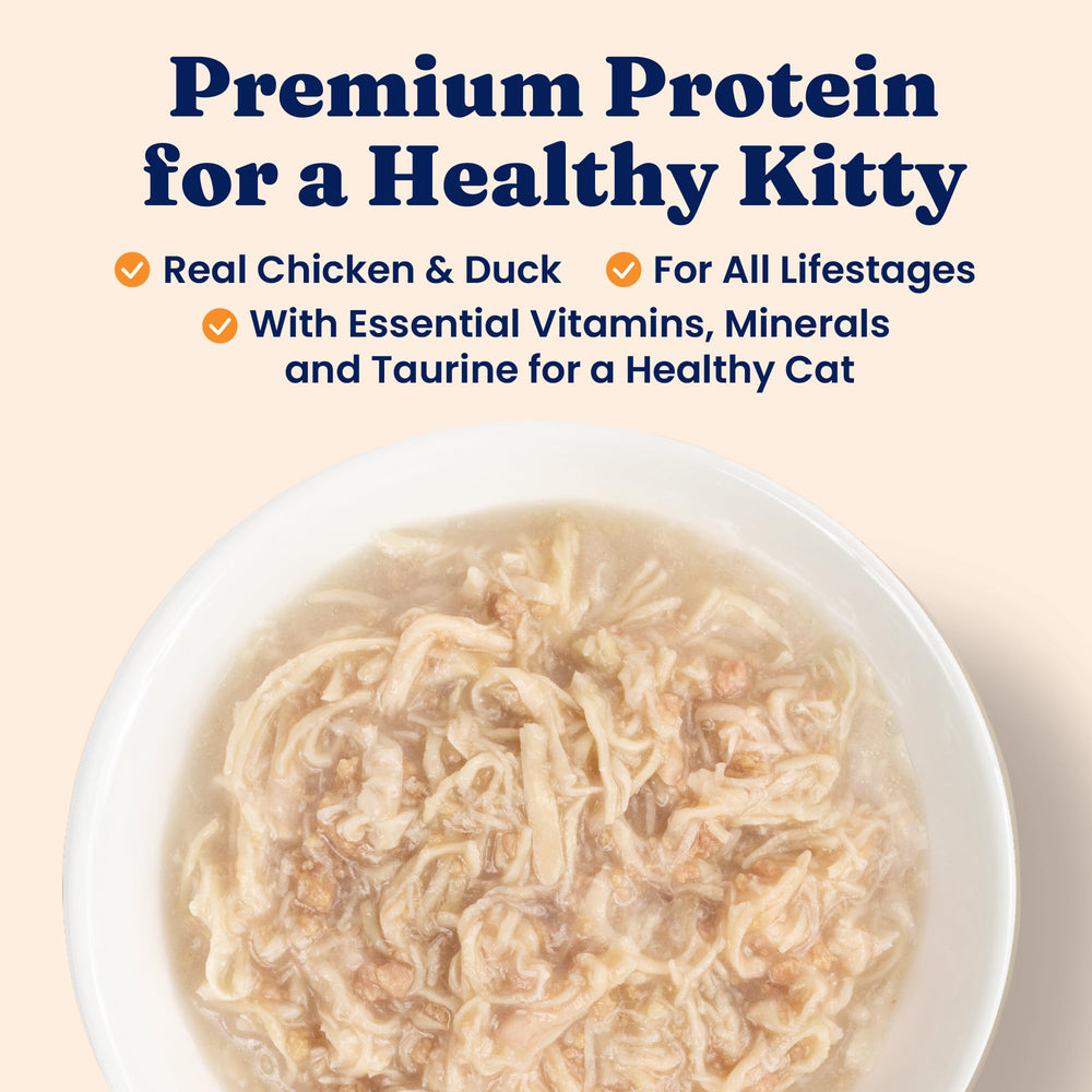 Solid Gold chicken and duck shreds in gravy close-up showing high-protein texture.