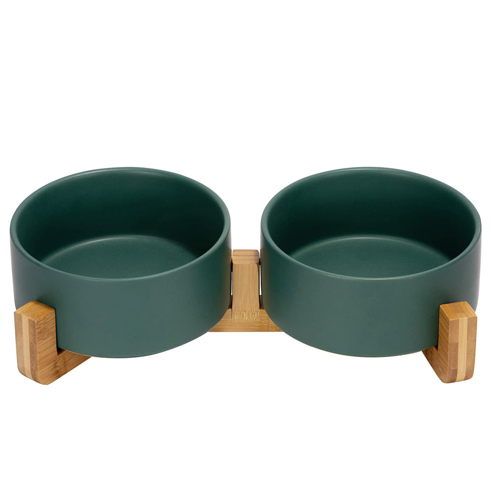 SPUNKYJUNKY ceramic dog and cat bowl on wood stand for elevated feeding.