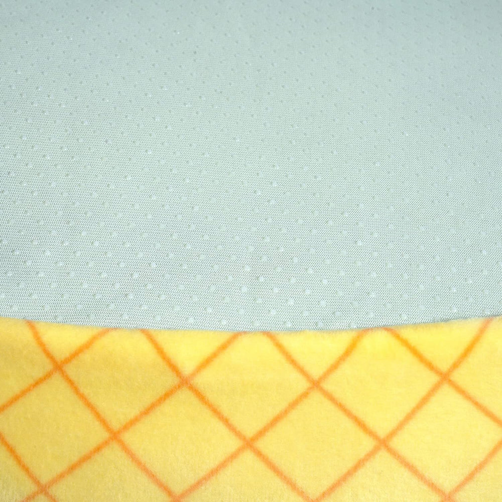 Squishmallows Maui Pineapple bolster edges showcase cushioned comfort and natural headrest.
