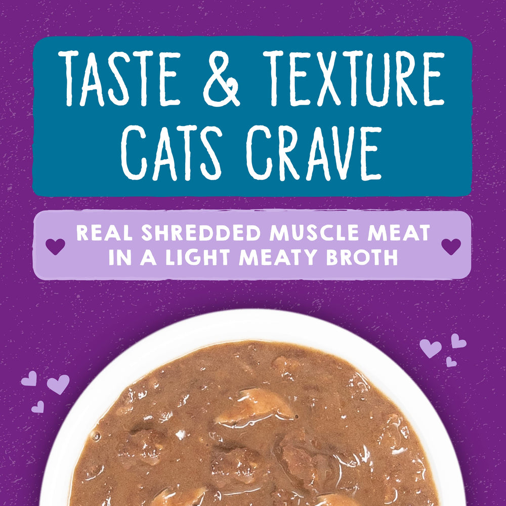 Stella & Chewy's Carnivore Cravings Savory Shreds cat enjoying tuna-mackerel meal for picky eaters.