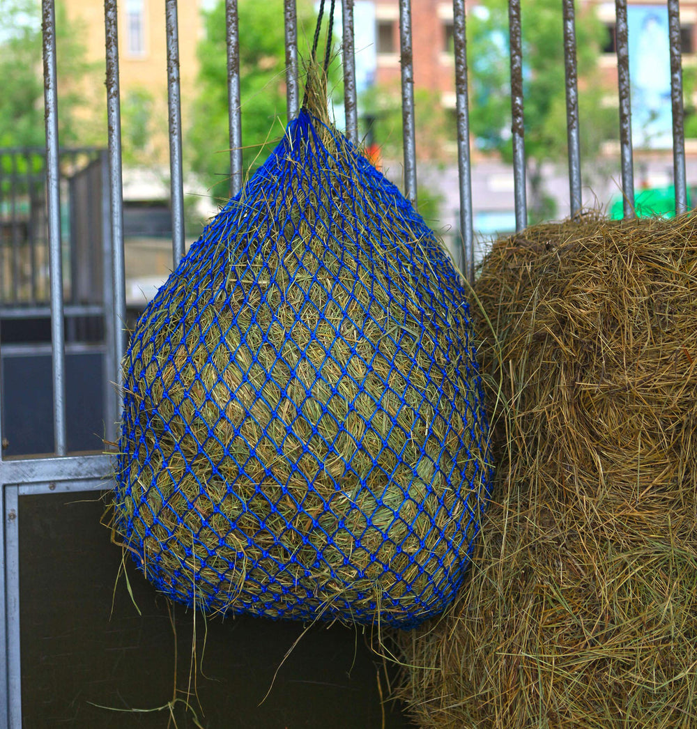 T TEKE Ultra Slow Hay Feeder Net in stable use for horses and goats.