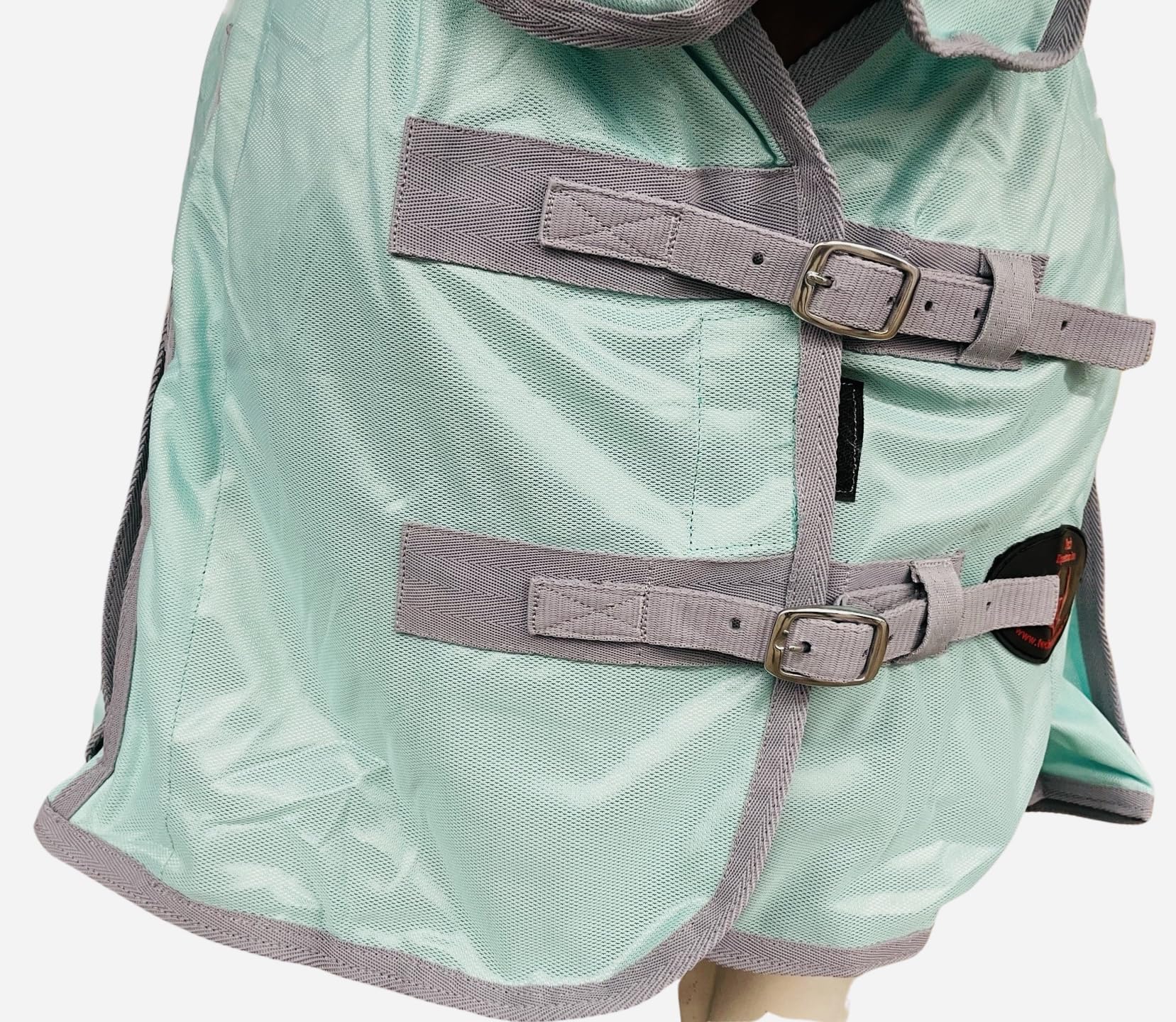 Tech Equestrian elastic leg straps and tail cover keep the sheet in place.