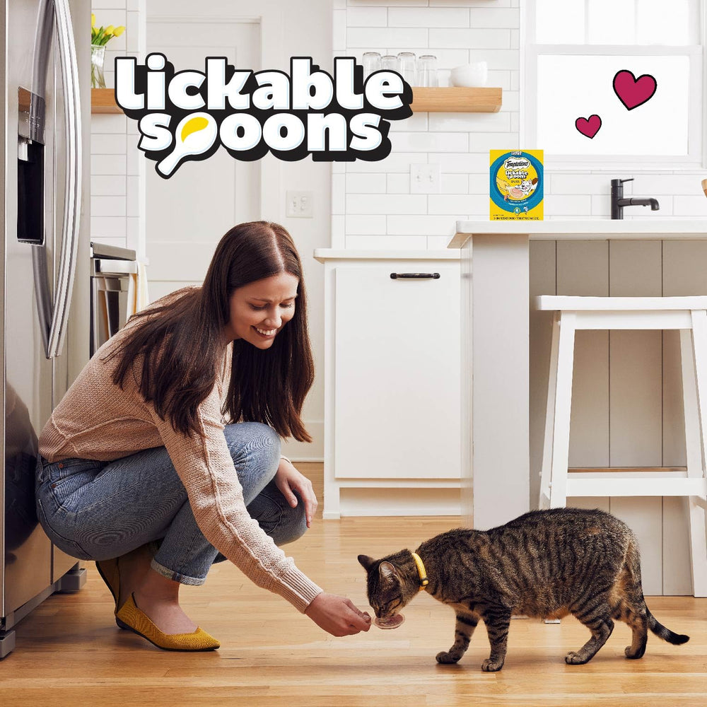 Cat enjoying reward and bonding moment after Temptations treat