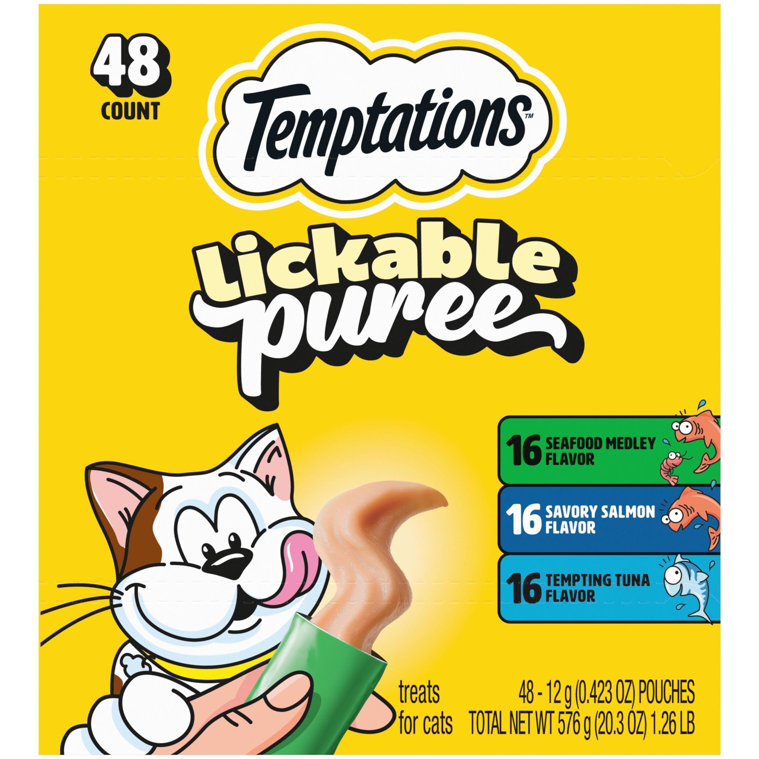 Temptations Creamy Puree tube being squeezed for a quick interactive cat treat.