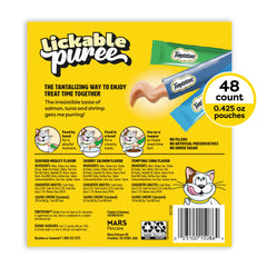Temptations lickable cat treats served by hand to enhance bonding.